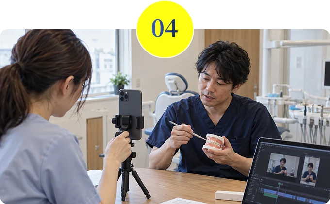 00：スマートフォンで撮影している歯科医院のスタッフと歯科医師